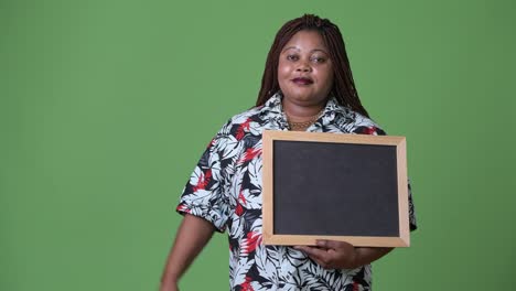 Overweight-beautiful-African-woman-against-green-background