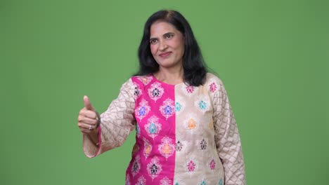 Mature-beautiful-Indian-woman-giving-thumbs-up