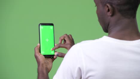 Young-African-man-using-phone