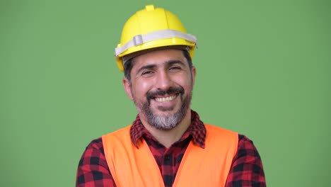 Handsome-Persian-bearded-man-construction-worker-smiling