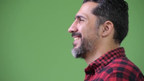 Profile-view-of-handsome-Persian-bearded-man-smiling