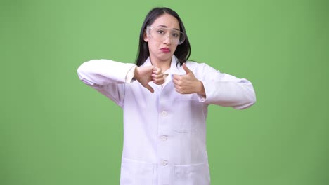 Young-beautiful-Asian-woman-doctor-wearing-protective-glasses