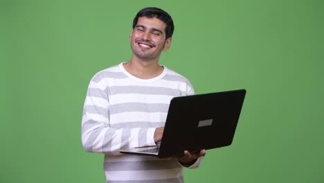 Young-handsome-Persian-man-using-laptop