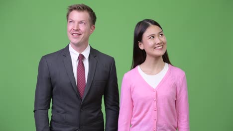 Young-Asian-woman-and-young-businessman-thinking-together