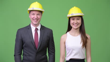 Multi-ethnic-business-couple-as-engineers-together