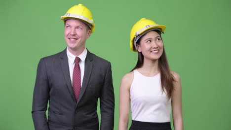 Multi-ethnic-business-couple-as-engineers-together