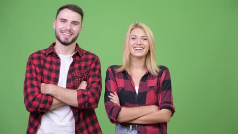 Young-couple-with-arms-crossed-together