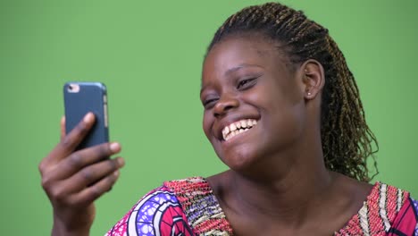 Young-African-woman-using-phone