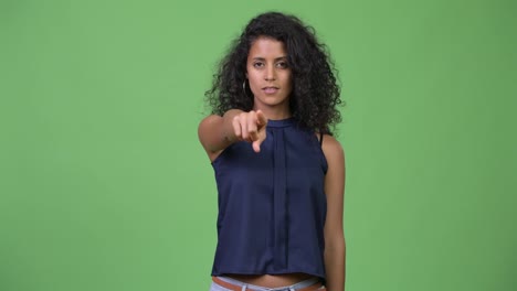 Young-beautiful-Hispanic-businesswoman-pointing-at-camera