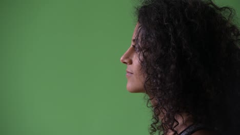 Profile-view-of-young-beautiful-Hispanic-woman-thinking-ready-for-gym