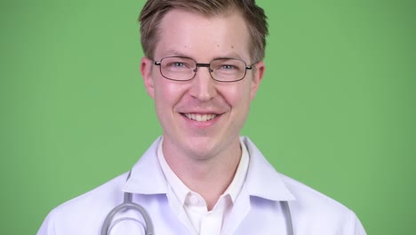 Portrait-Of-Young-Man-Doctor-Smiling