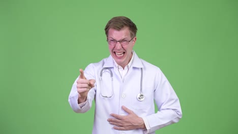 Man-Doctor-Laughing-And-Pointing-Finger