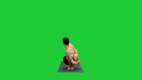 Young-man-doing-squat-with-twist-and-bend-yoga-on-a-Green-Screen,-Chroma-Key