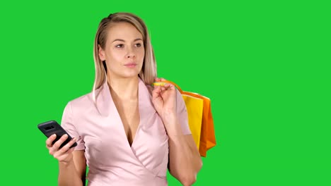 Shopping-woman-text-messaging-on-a-Green-Screen,-Chroma-Key