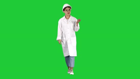 Young-female-engineer-or-architect-making-presenting-gestures-and-talks-on-a-Green-Screen,-Chroma-Key