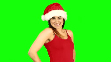 Pretty-girl-in-santa-hat-enviando-un-beso-de-aire