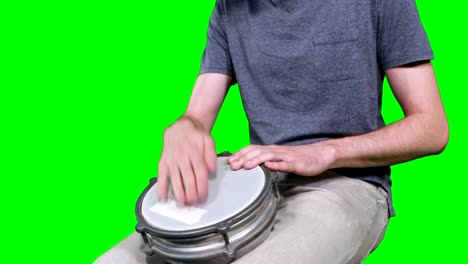 Mid-section-of-drummer-playing-drum