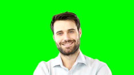 Smiling-man-standing-against-green-screen