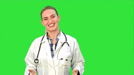 Smiling-beautiful-woman-in-lab-coat-talking-to-the-camera-on-a-Green-Screen,-Chroma-Key