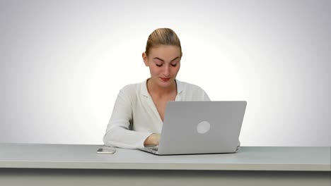 Young-secretary-tired-at-work-place,-yawn-on-white-background