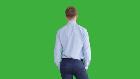 Young-Handsome-Men-Acting-in-Front-of-a-Green-Screen.-Blond-Hair,-Blue-Shirt-and-Blue-Trousers.-Dancing,-Thinking,-Turning-Around-and-Talking-to-the-Camera.