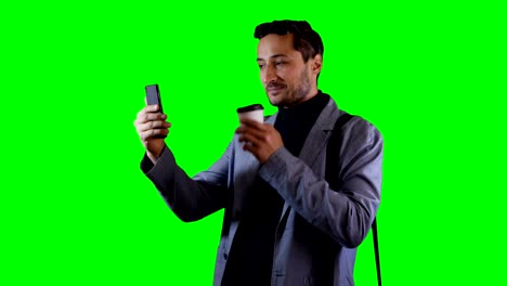 A-man-is-talking-on-a-mobile-phone-in-video-mode