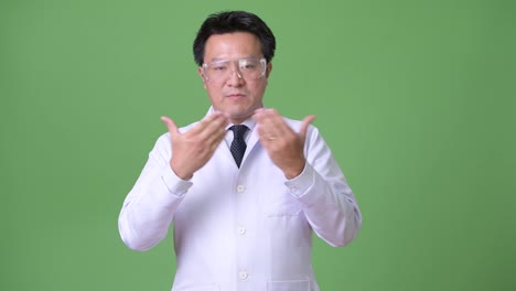 Mature-Japanese-man-doctor-wearing-protective-glasses