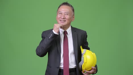 Mature-Japanese-businessman-as-engineer-thinking