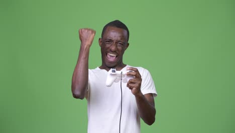 Young-excited-African-man-playing-games