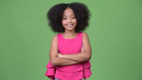 Young-cute-African-girl-with-Afro-hair-crossing-arms