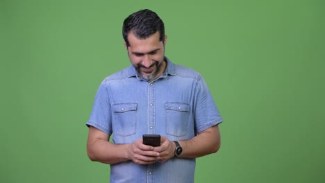 Handsome-Persian-bearded-man-using-phone