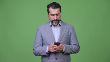 Handsome-Persian-bearded-businessman-using-phone