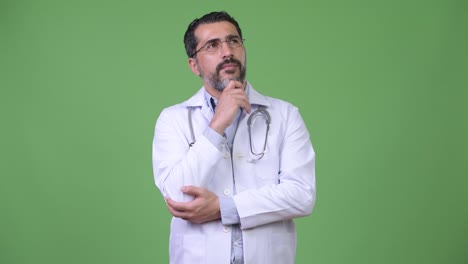 Handsome-Persian-bearded-man-doctor-thinking