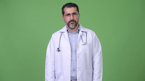 Handsome-Persian-bearded-man-doctor-giving-thumbs-up