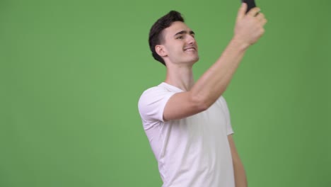 Young-handsome-man-video-calling-with-phone