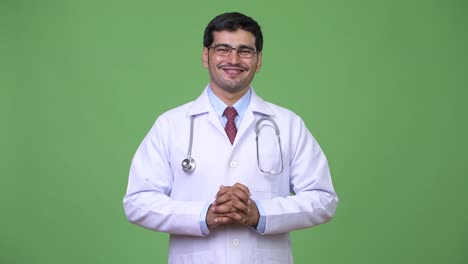 Young-handsome-Persian-man-doctor-talking