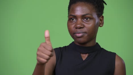Young-beautiful-African-businesswoman-giving-thumbs-up