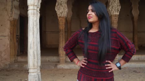 Cute-young-lady-angry-looks-around-smiles-happy-livid-points-finger-straight-at-camera-warns-giving-instructions-order-firing-pissed-lover-POV-handheld-mid-shot-date-late-consequences-at-a-temple