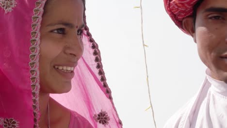 Beautiful-couple-in-traditional-dress-talking-and-holding-hands-in-Rajasthan,-India