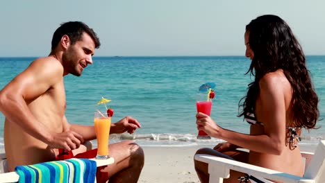 Happy-couple-drinking-a-cocktail-together