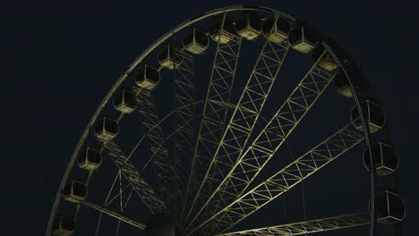 Locked-on-shot-of-Ferris-wheel-at-night