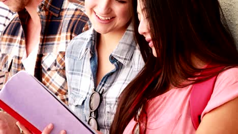 Hipster-friends-holding-notebooks