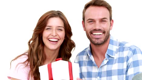 Smiling-man-offering-gift-to-his-girlfriend