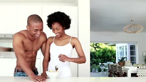 Romantic-smiling-couple-taking-breakfast-together