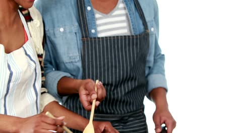 Happy-young-couple-cooking-together