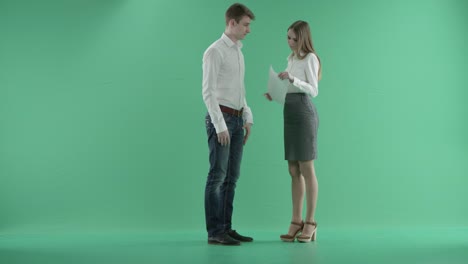 Angry-Businesswoman-Scolding-Her-male-Colleague-And-Throwing-Papers-Up-In-Air-on-a-green-screen