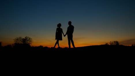 Lovers-on-sunset-background.