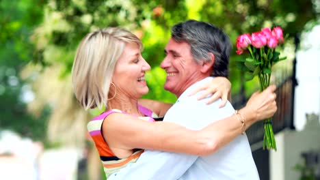 Man-giving-flowers-to-a-woman