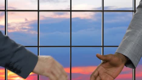 Business-handshake-on-sunset-background.