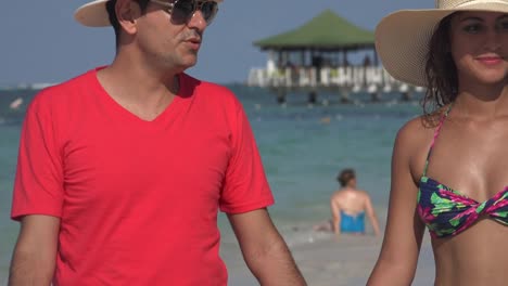 Married-Couple-Walking-On-Beach